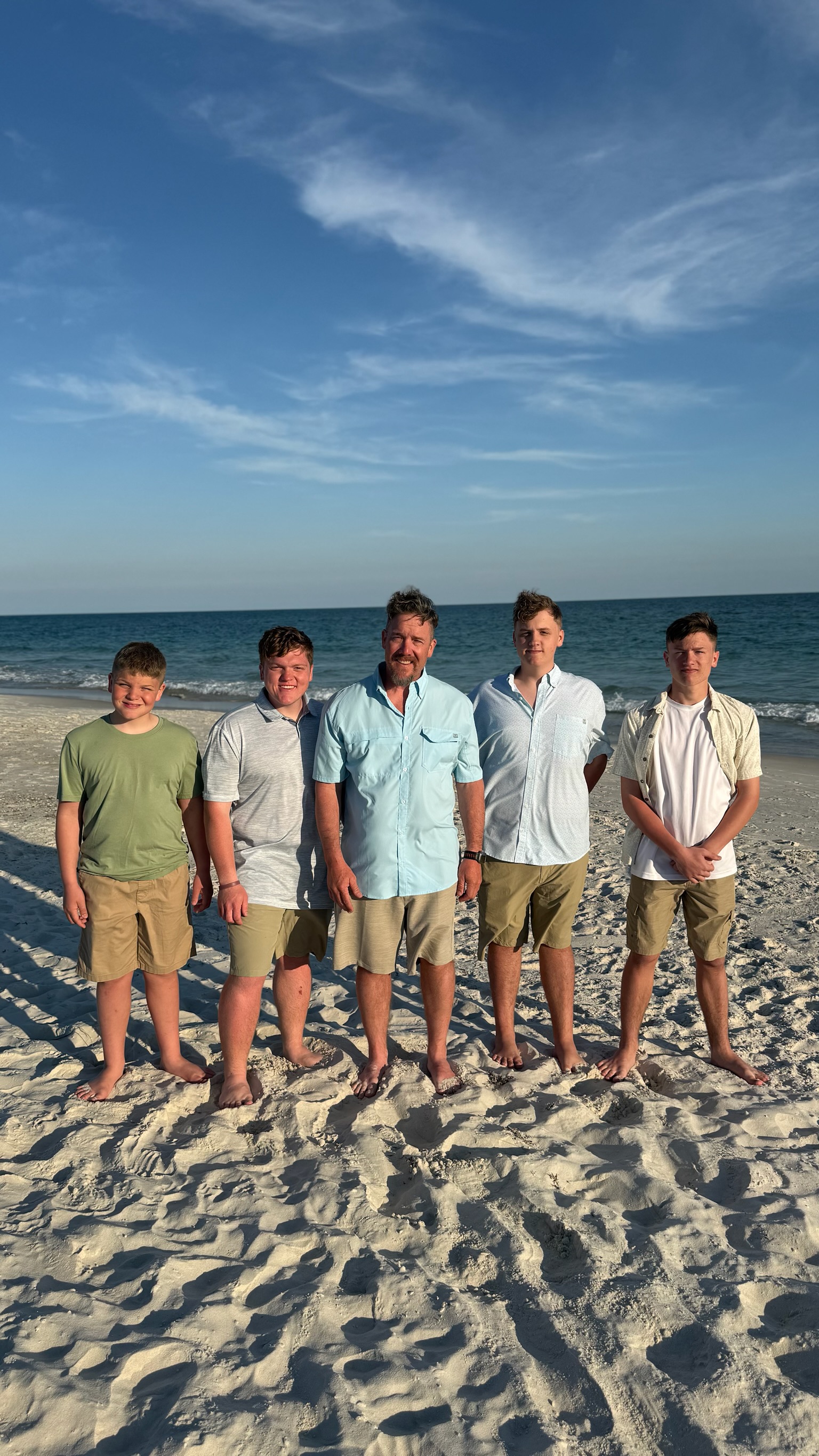Dave Norris with his sons on the beach